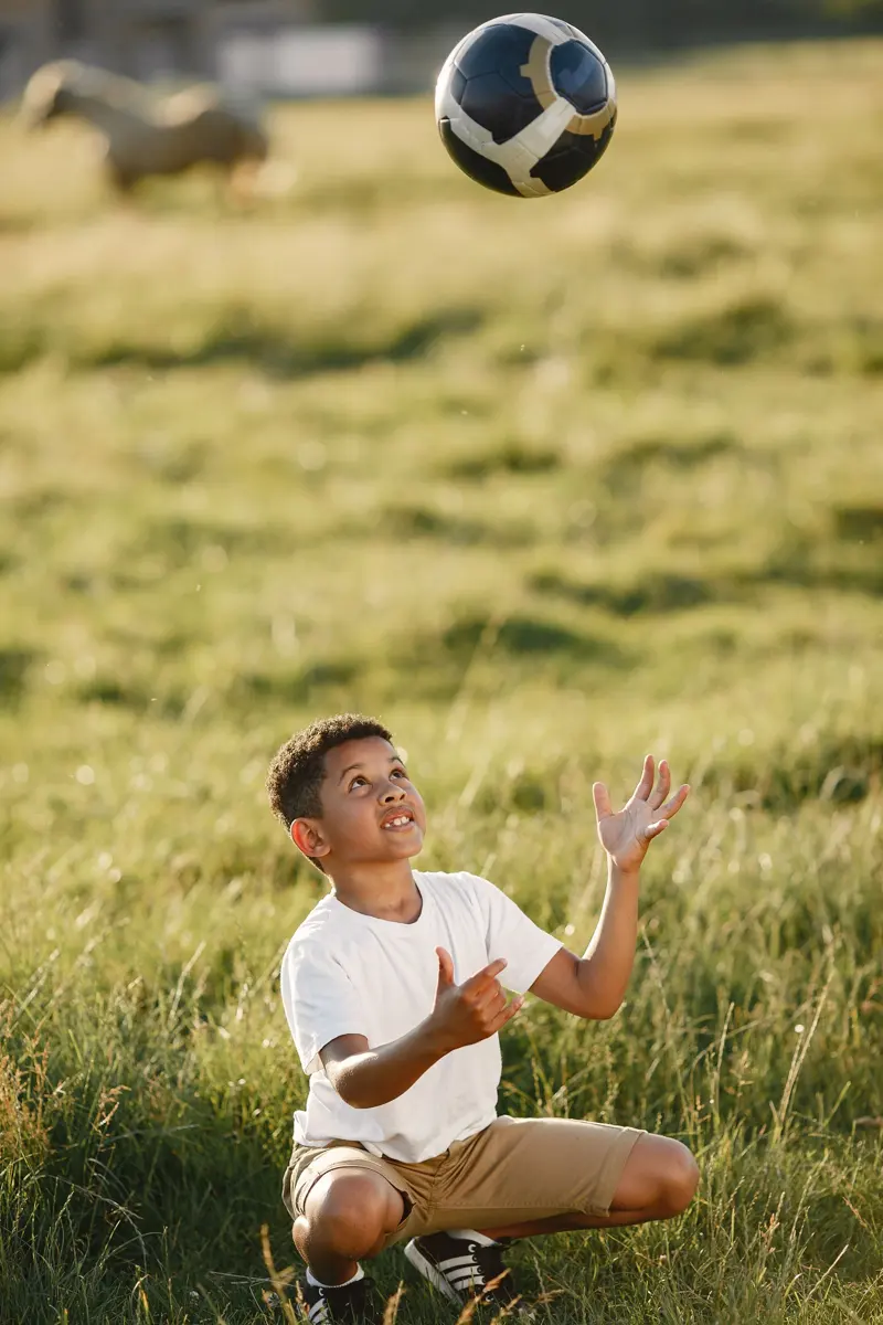 A boy catching a football
