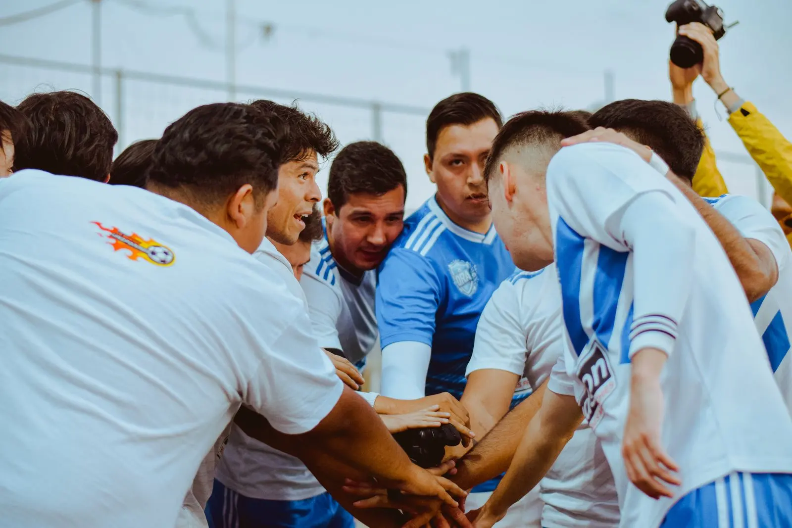 A team huddling together before a match