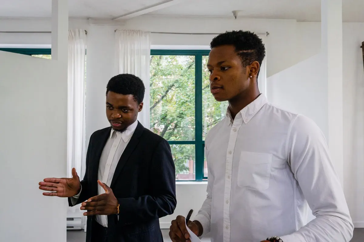 Two young professionals in conversation